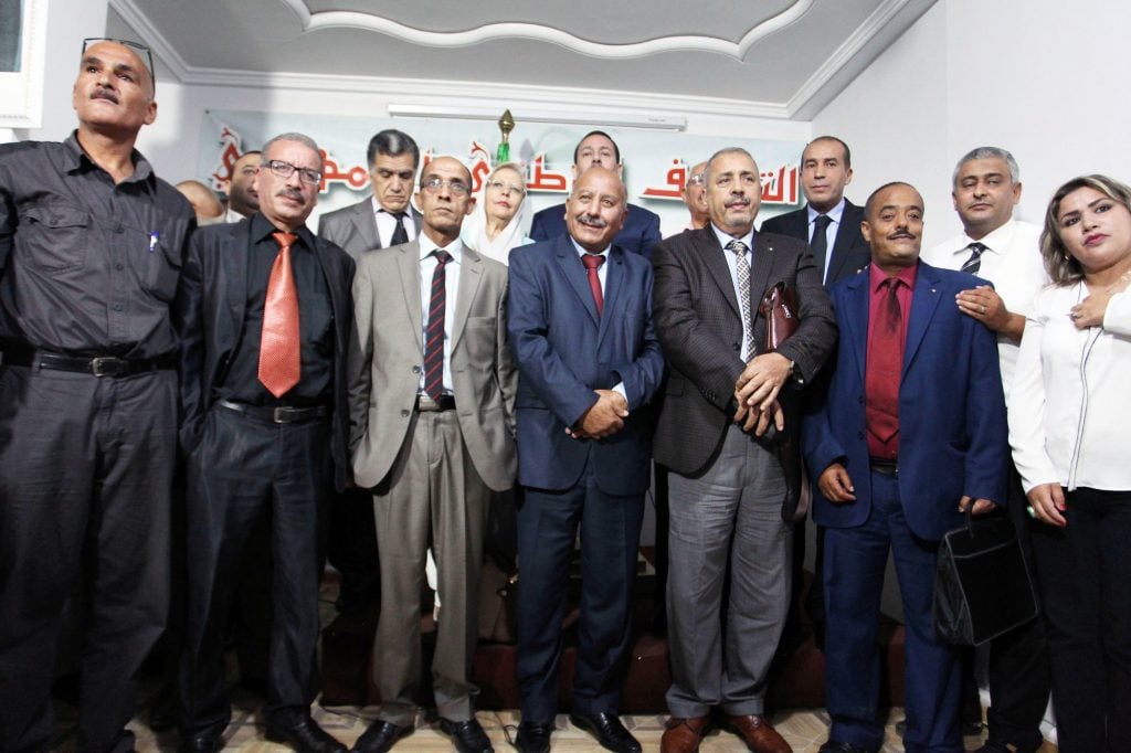 Les responsables des quinze petites formations qui défendent la candidature du président sortant, le 15 août, à Alger. © Anis Belghoul/NewPress PPAGENCY/SIPA PRESS