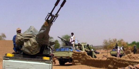 Des membres d’un groupe armé dans des véhicules, à Kidal, au Mali, le 13 juillet 2016.